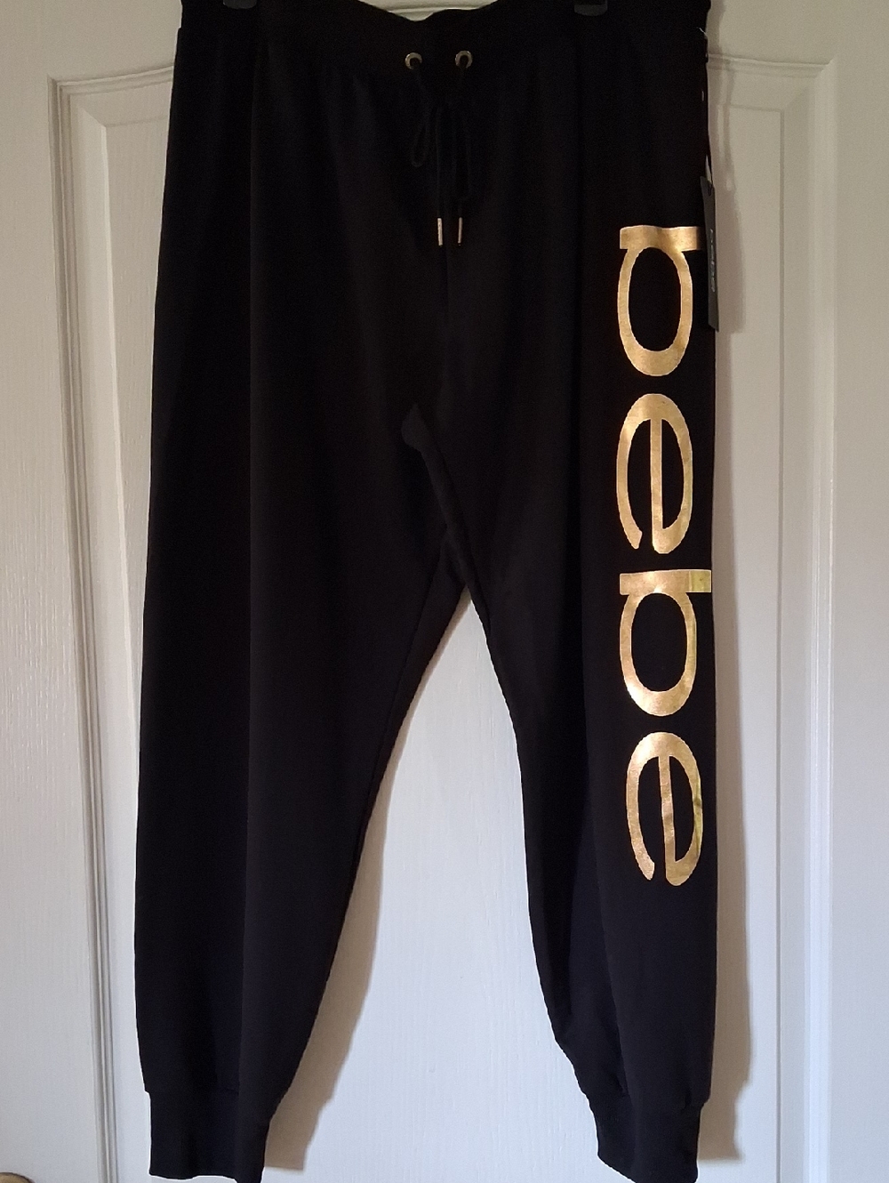 Bebe Black Joggers with Metallic Gold Logo Down Leg